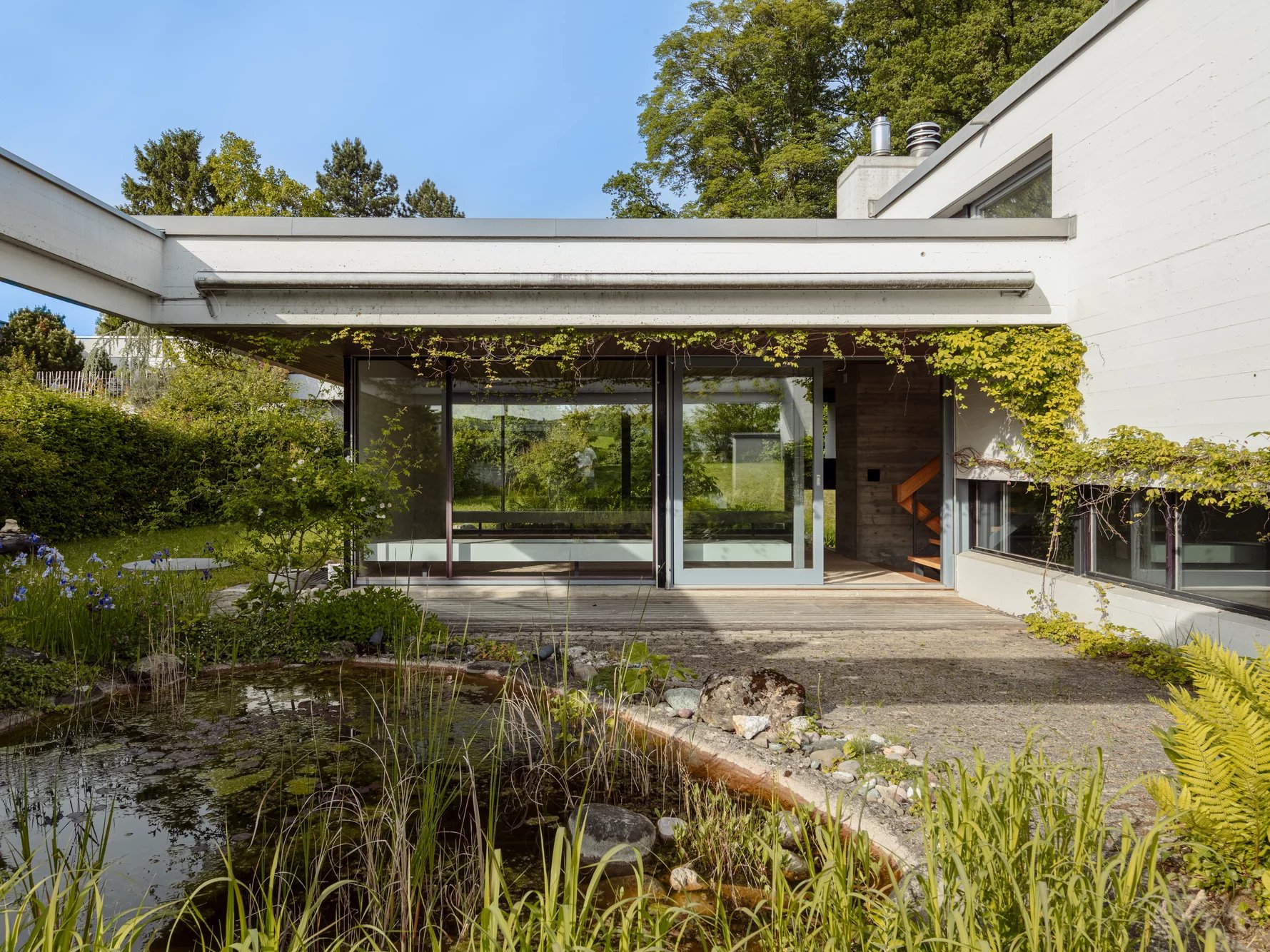 An architectural gem with a natural pond and development potential