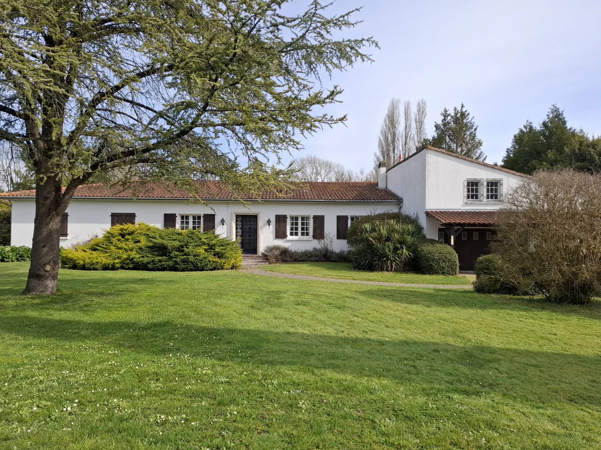 Large and light attractive family home with established gardens on edge of pretty village