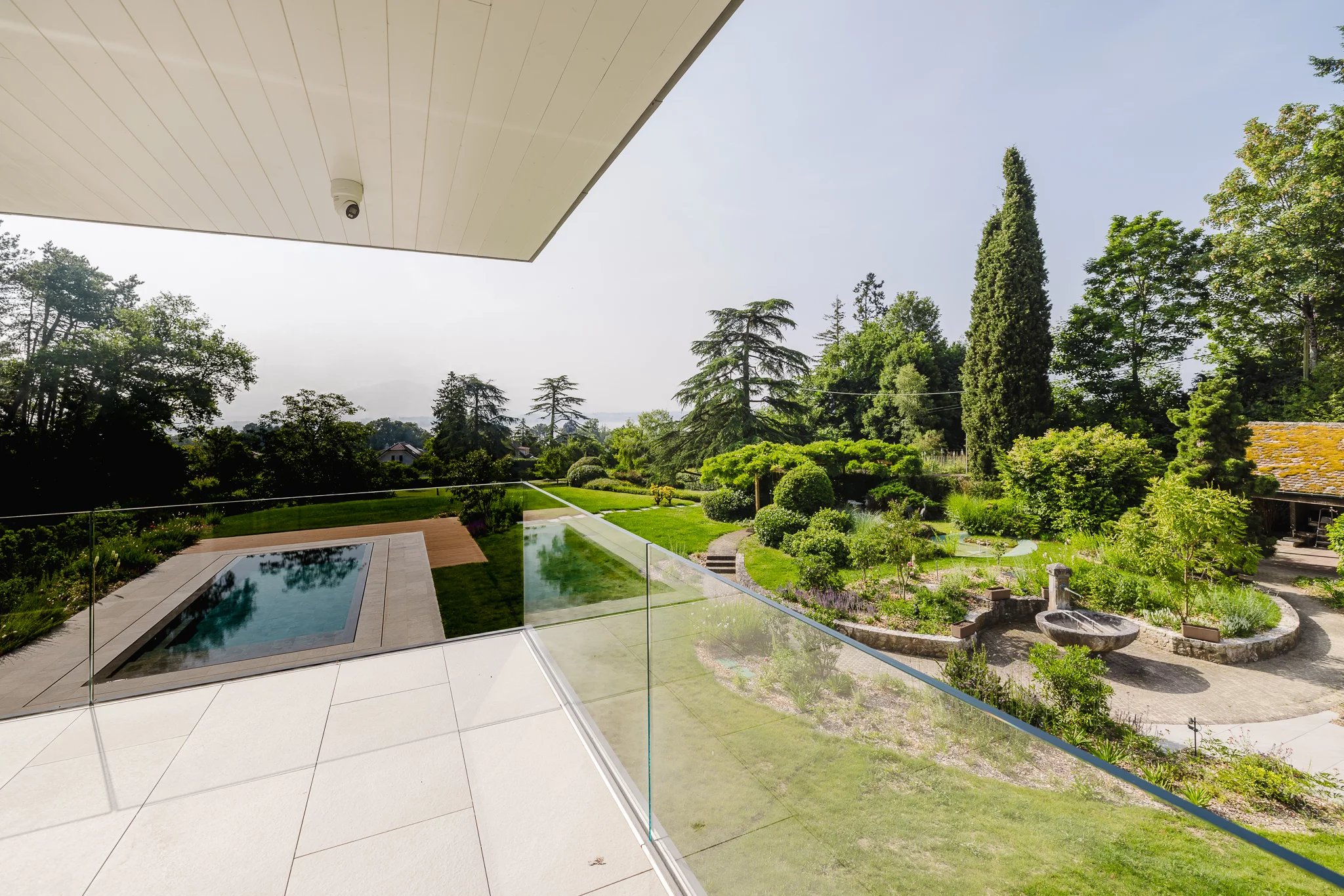 A haven of light and serenity with lake and pool views