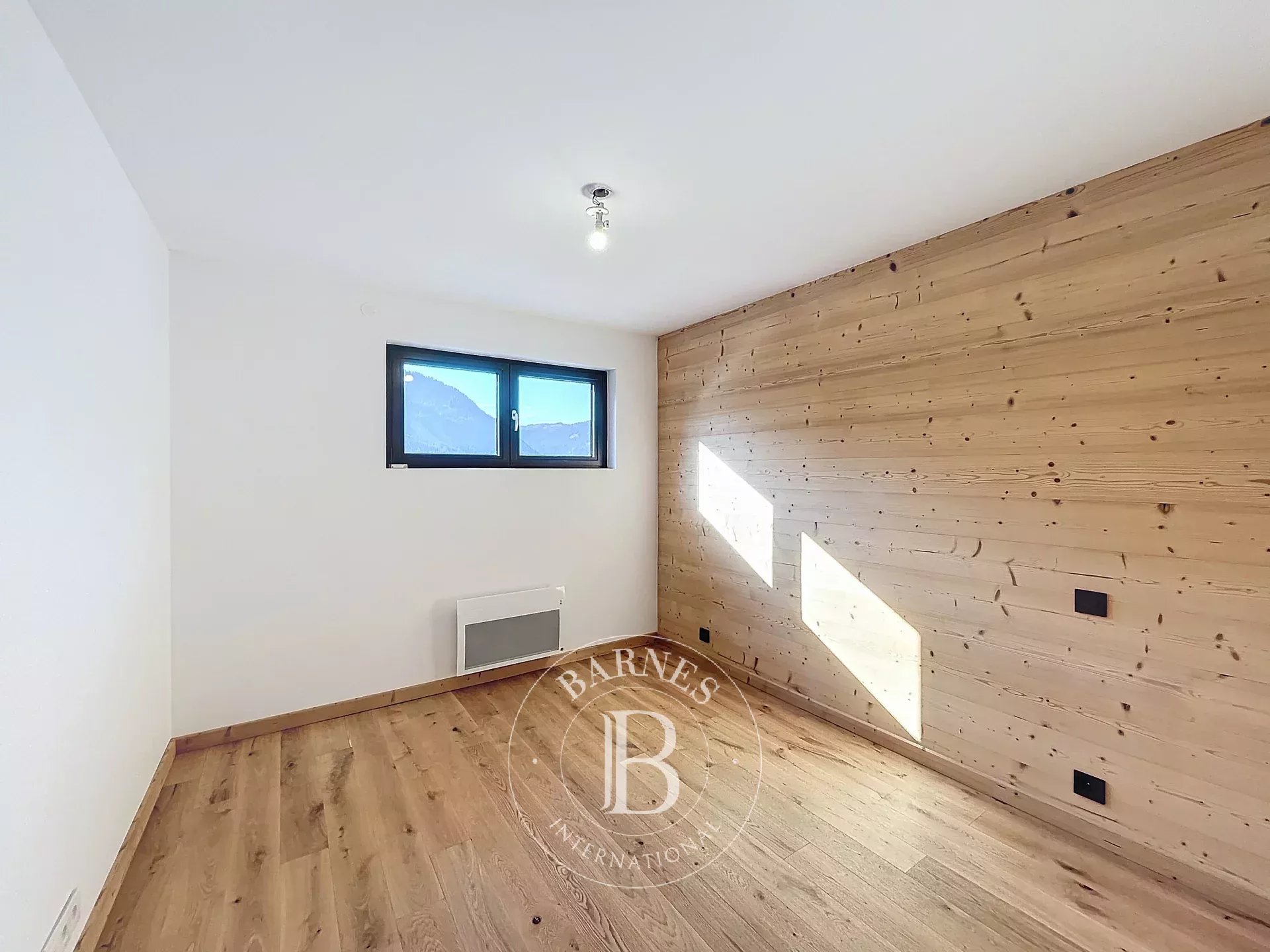 Photo of Châtel - T4 apartment (2023) of approximately 107,22 sq m of living space - 3 bedrooms - Village heart - Panoramic view - Fireplace - 2 covered parking spaces