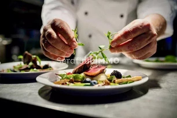 Chef adding the final flourish by adding some liquorice flavoured  parsley to the dish. The dish is, pan fried pink duck breast onto a bed of parsnip puree with seasonal autumn vegetables and berries.