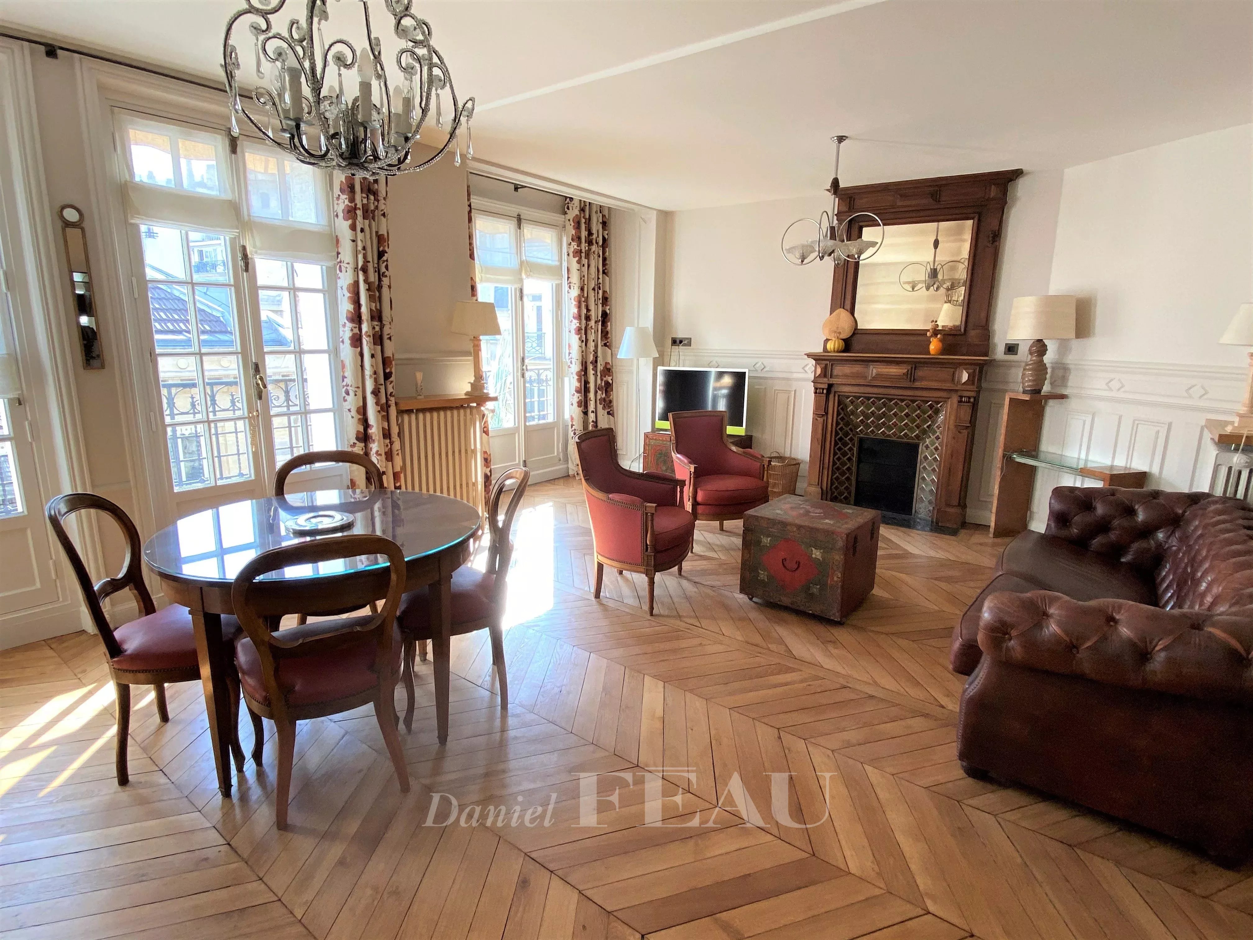 Dining room Wooden floor Fireplace Chandelier