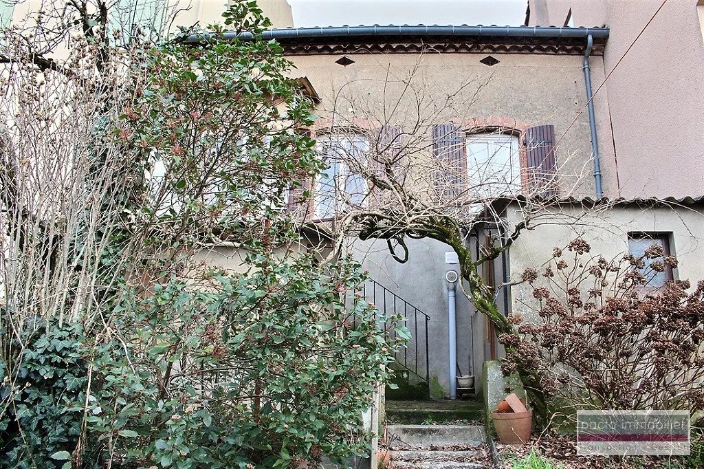 Maison de ville avec garage et jardin