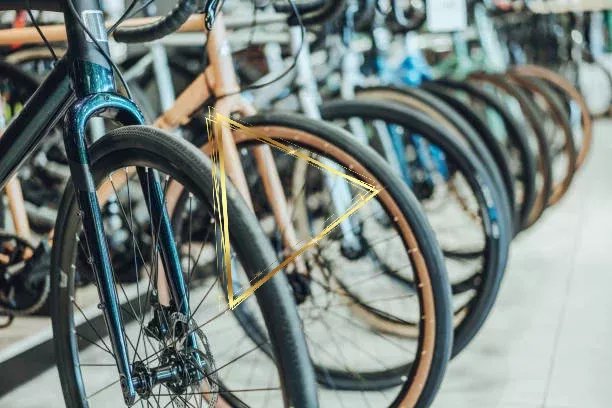 Bicycles parked in a bike shop
View of front wheels and tires, Selective Focus