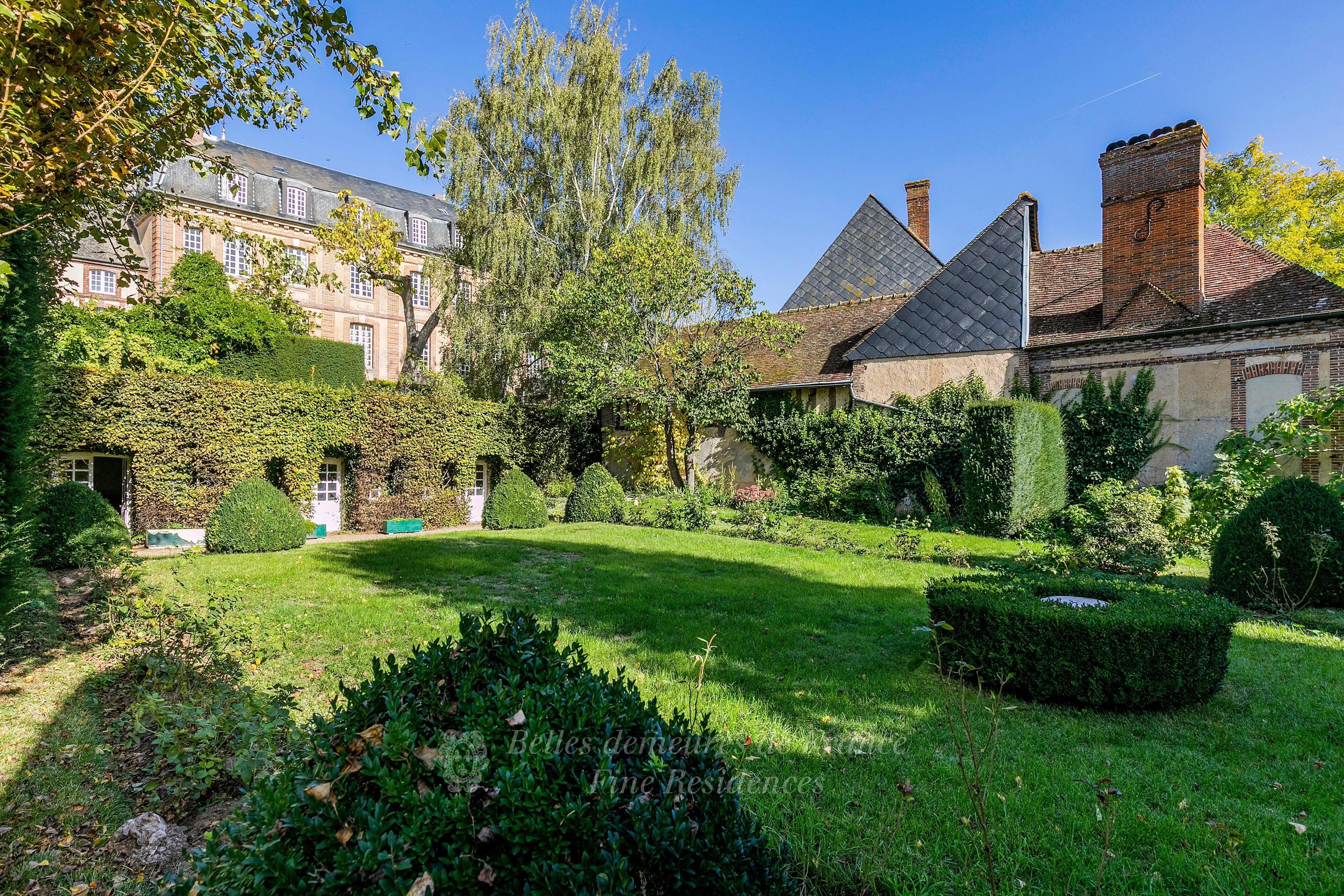 1h15 from Paris. A listed Louis XV style private mansion in perfect condition Set in leafy walled grounds with terraces and annexes