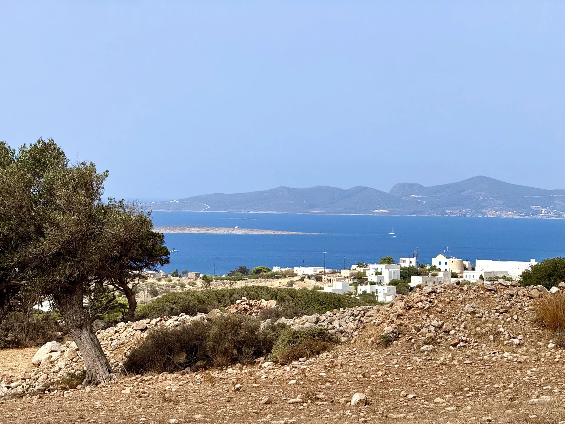 FOR SALE – PLOT WITH SEA & SUNSET VIEWS AND PERMIT FOR 4 HOMES – PAROS ISLAND