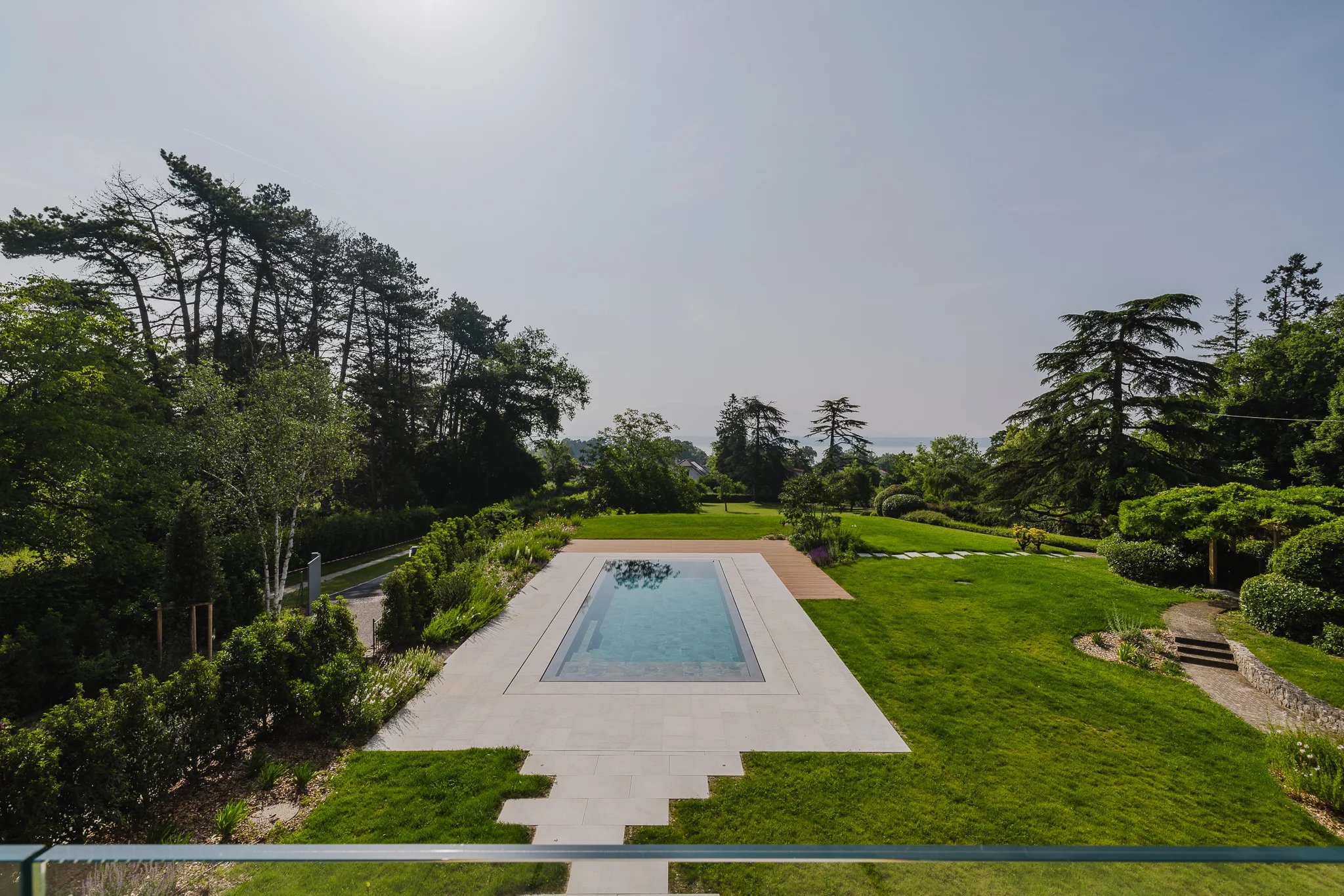 A haven of light and serenity with lake and pool views