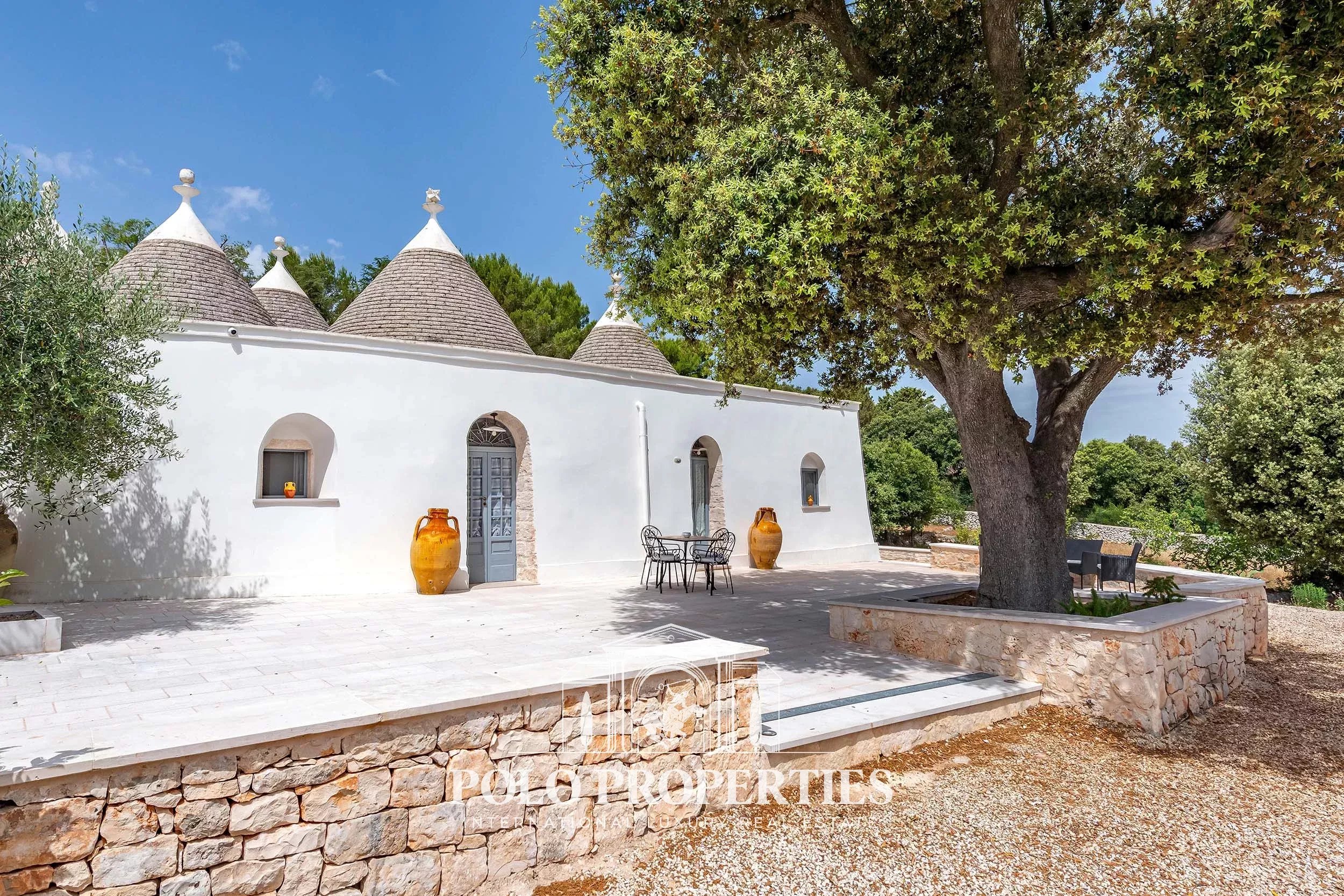 CHARACTER PROPERTY WITH TRULLI, SWIMMING POOL AND ADRIATIC SEA VIEWS IN THE PINE FOREST OF SELVA DI FASANO