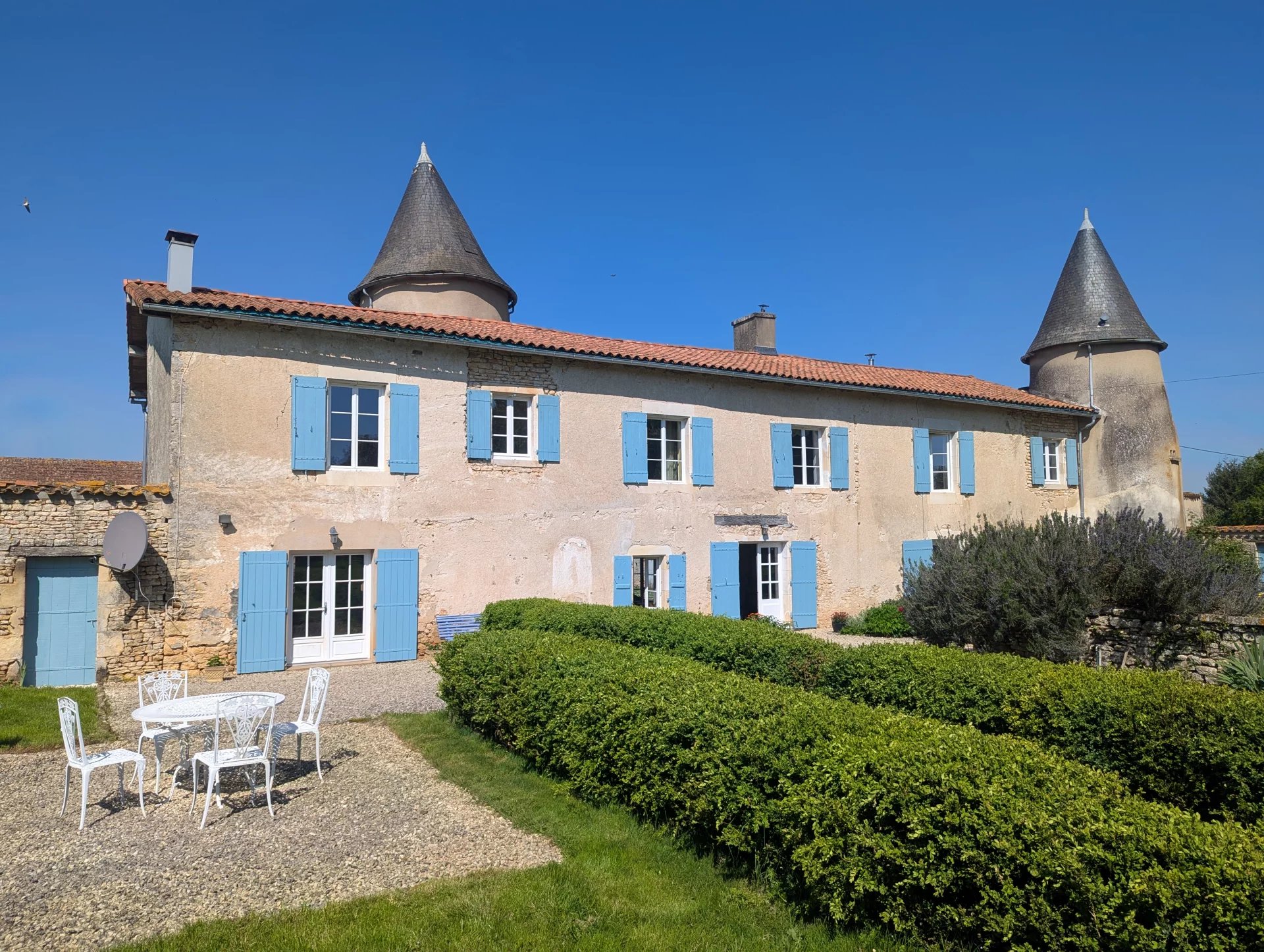 Historic chateau with impressive outbuildings, land and woodland