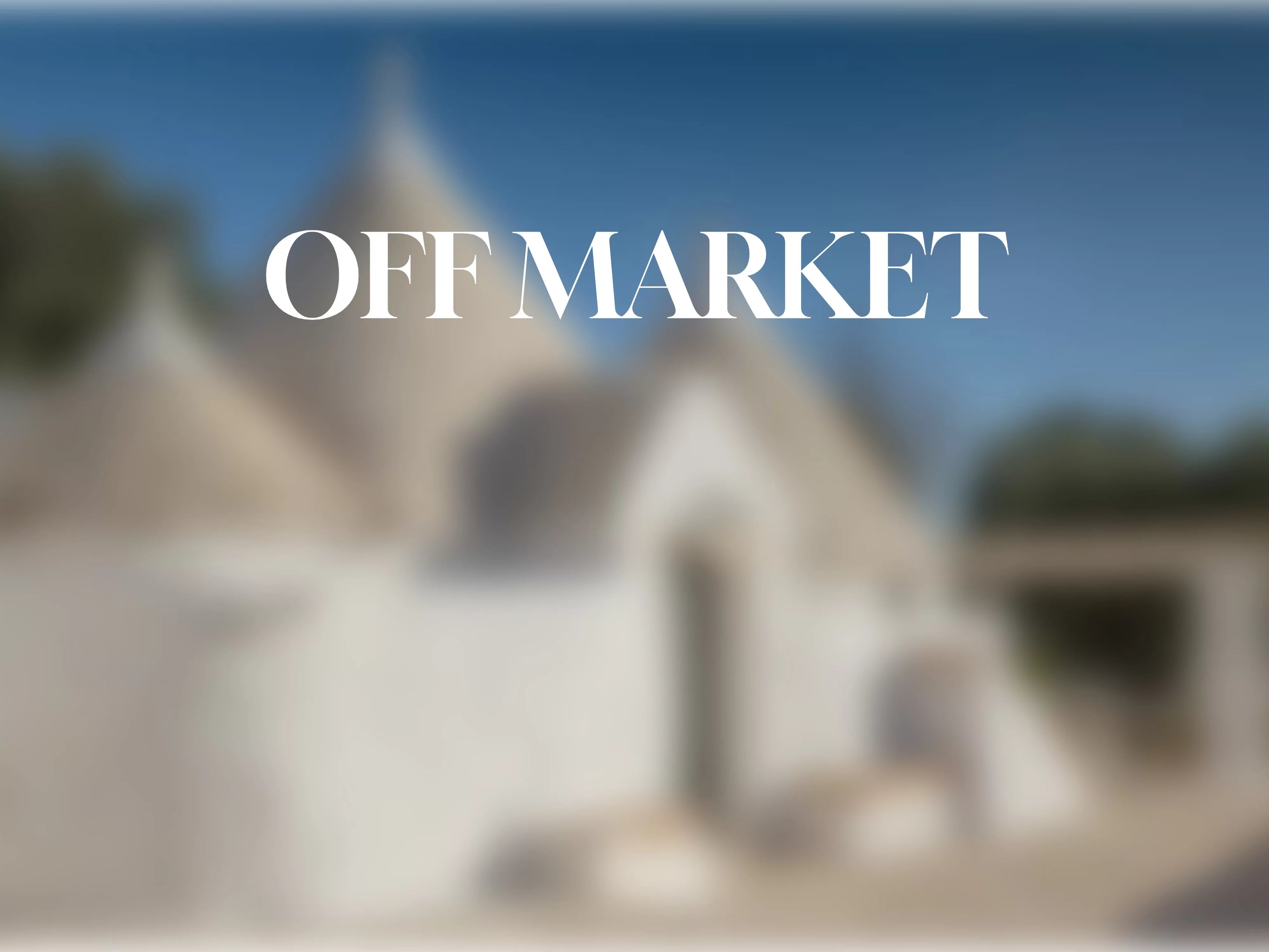 ELEGANT TRULLO AND LAMIE, WITH INFINITY POOL SET AMONG CENTURIES-OLD OLIVE TREES