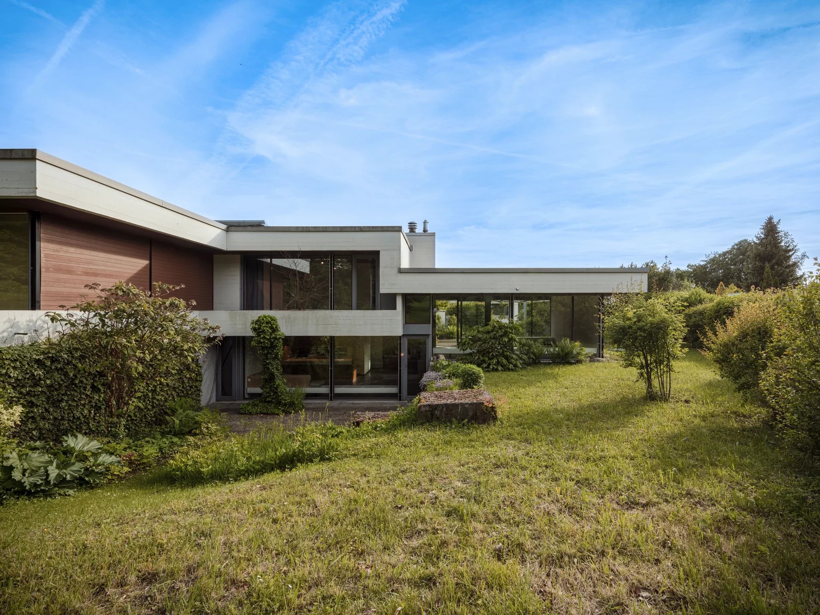 An architectural gem with a natural pond and development potential