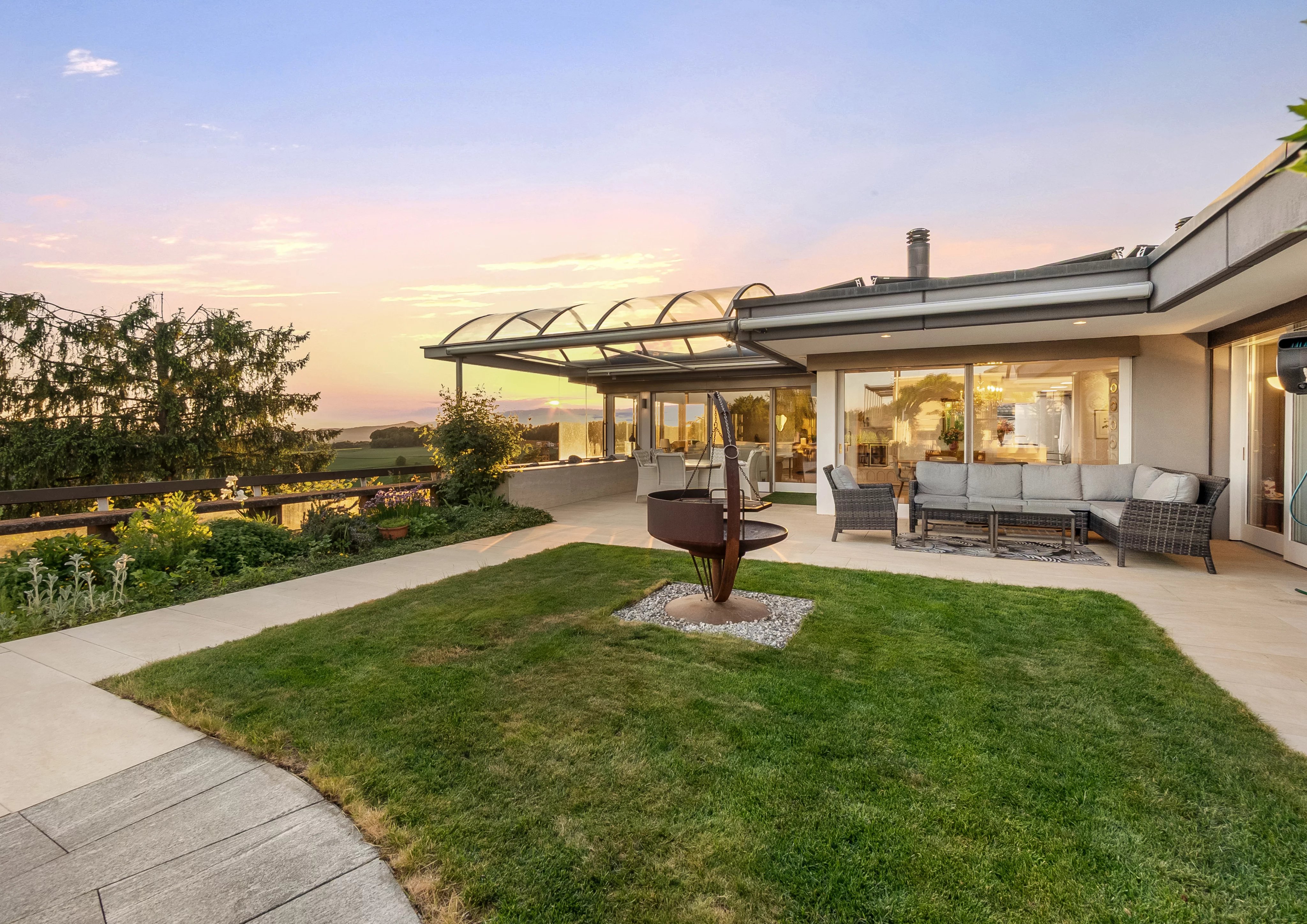 A timeless designer villa on a sunny hillside with a stunning garden