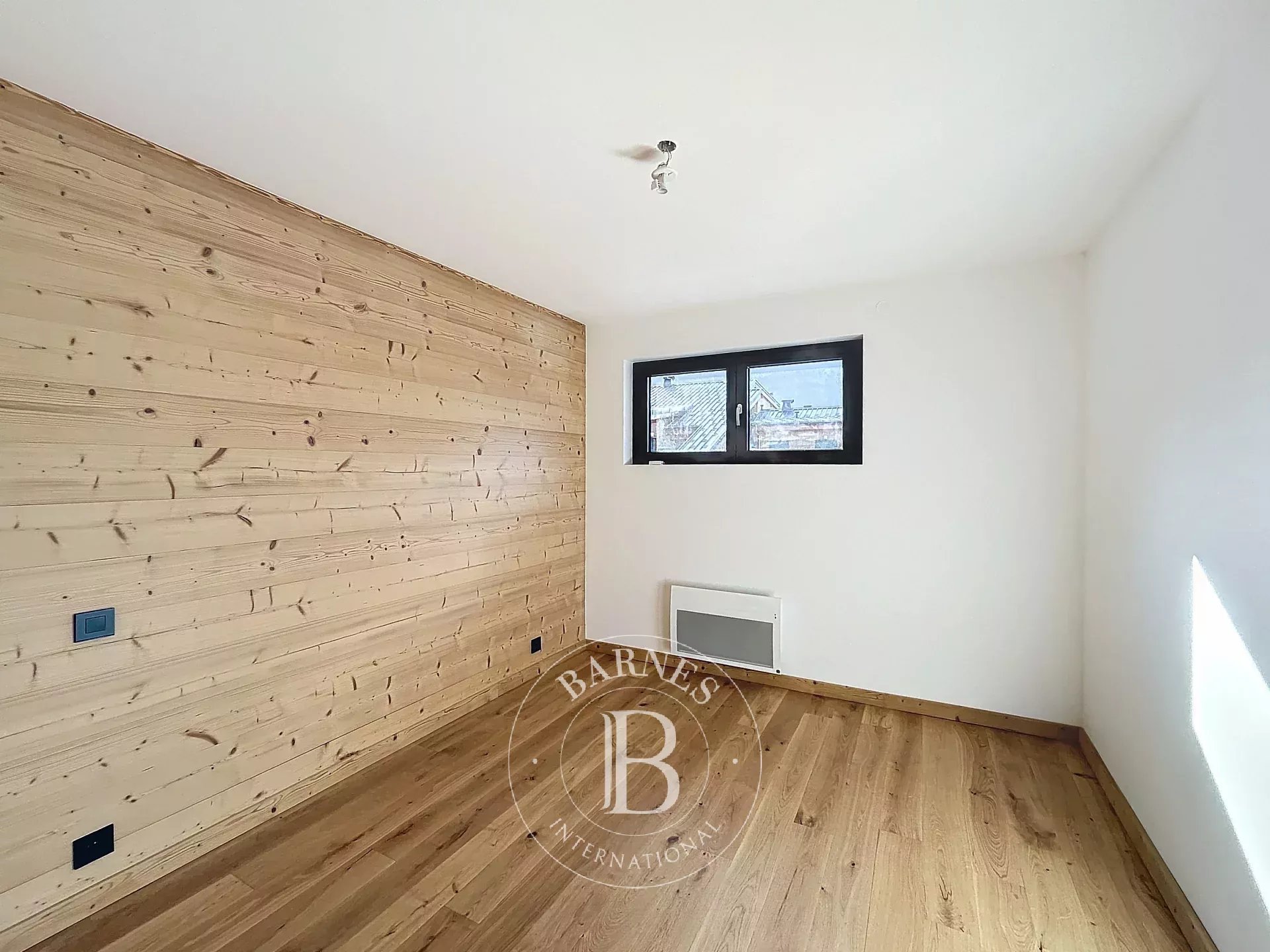 Photo of Châtel - T4 apartment (2023) of approximately 107,22 sq m of living space - 3 bedrooms - Village heart - Panoramic view - Fireplace - 2 covered parking spaces