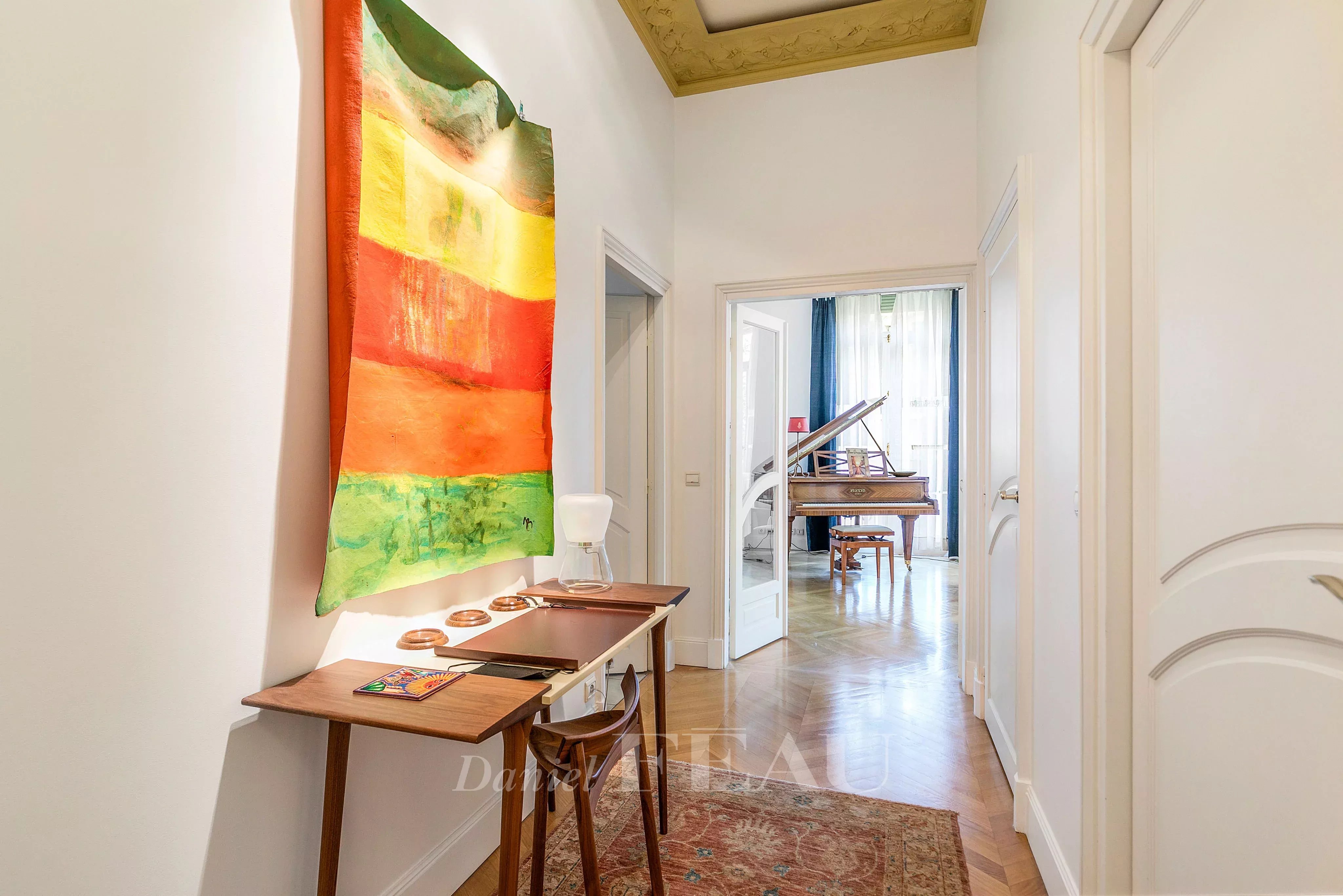 Corridor, herringbone parquet flooring, high ceiling