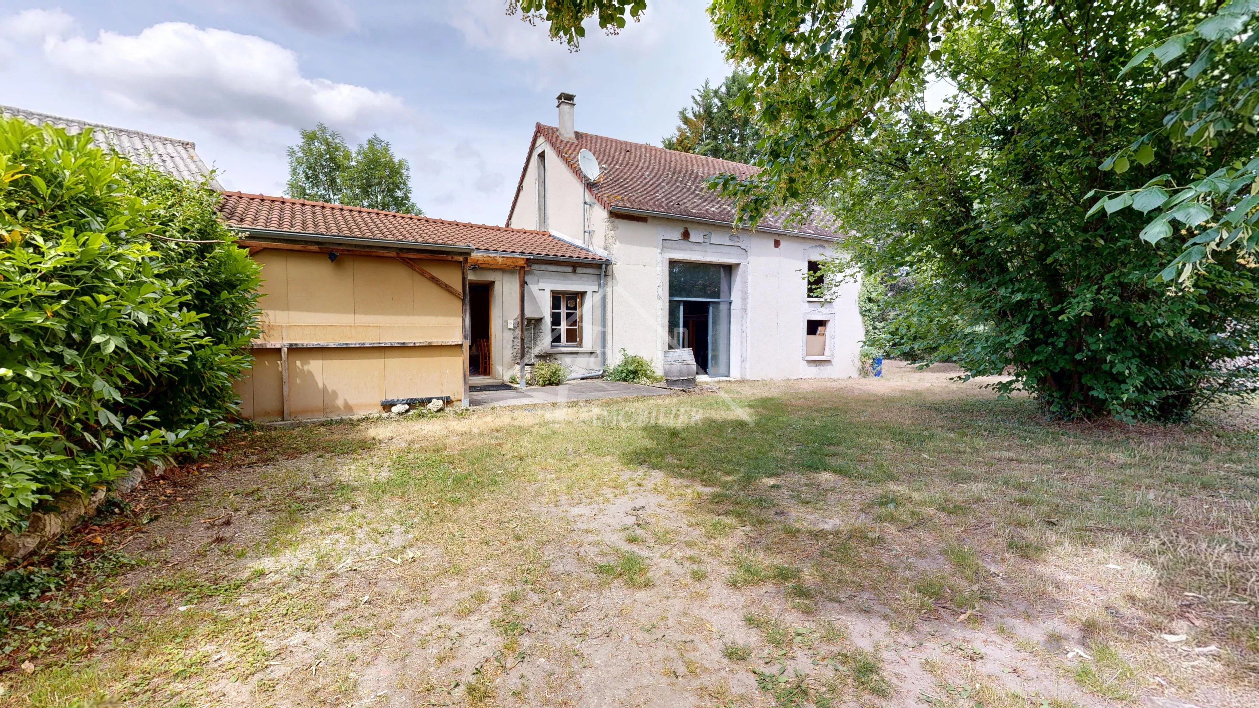 Maison avec grange et terrain