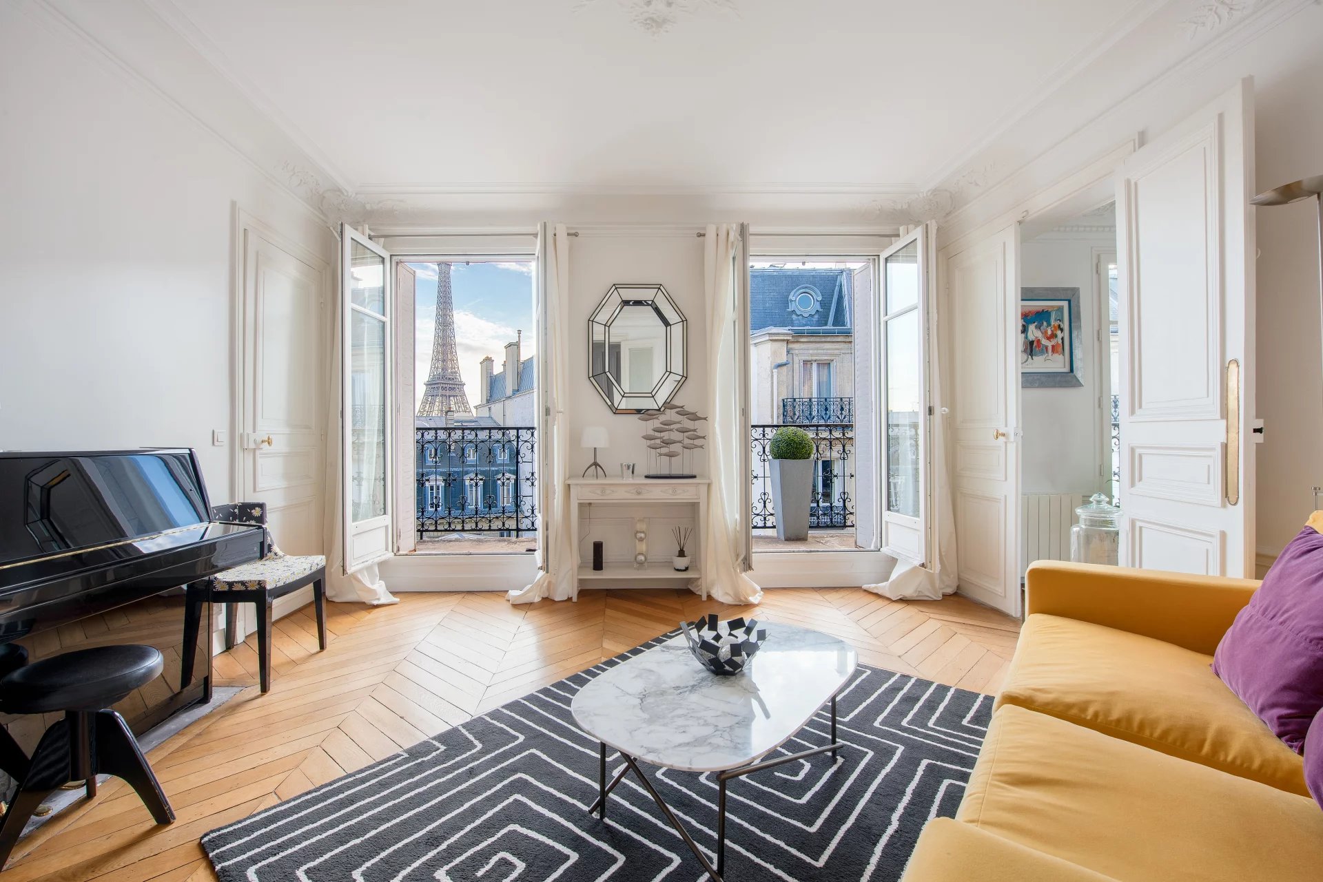 High floor apartment with balcony and unobstructed view of the Eiffel Tower