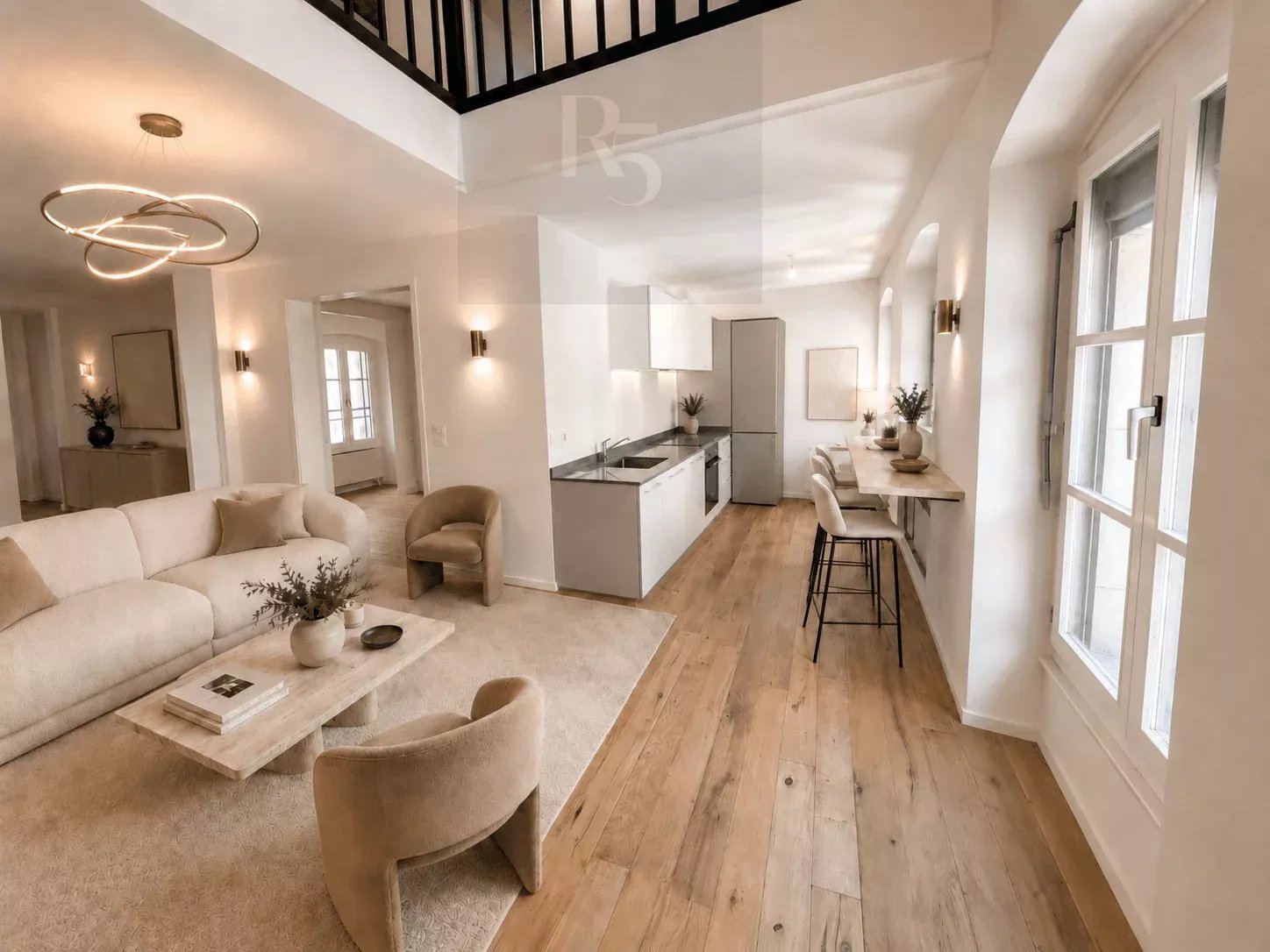 Bright and airy open-concept living space with modern furnishings and large windows.