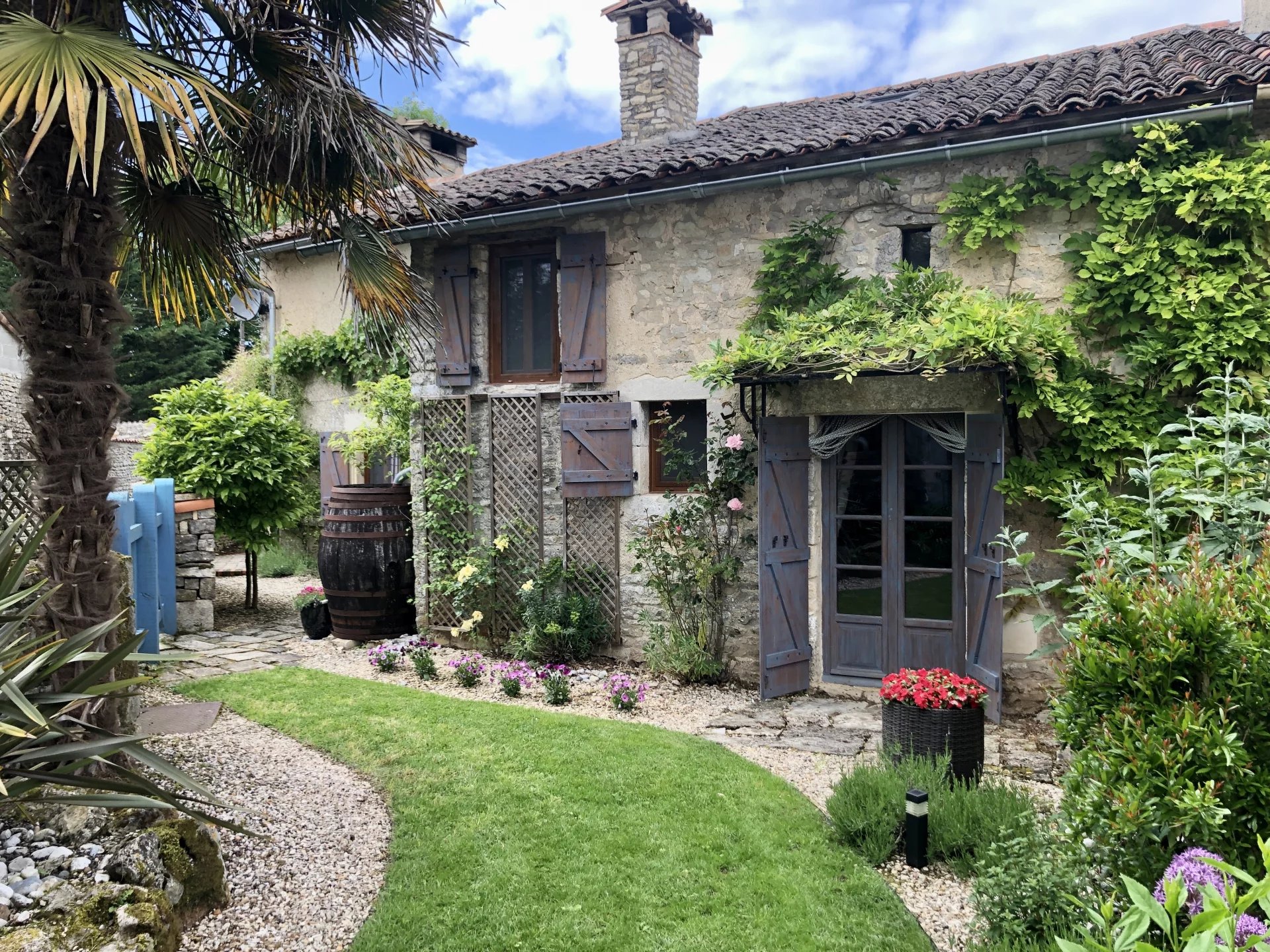 Gorgeous renovated stone cottage with barn and low maintenance garden