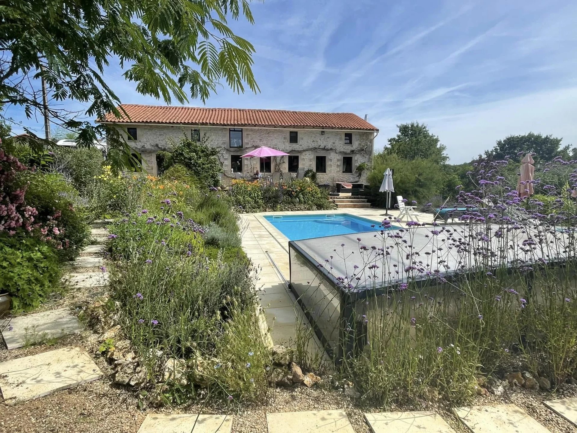 Charming Five-Bedroom Stone Home with Pool and Gardens in Peaceful Village
