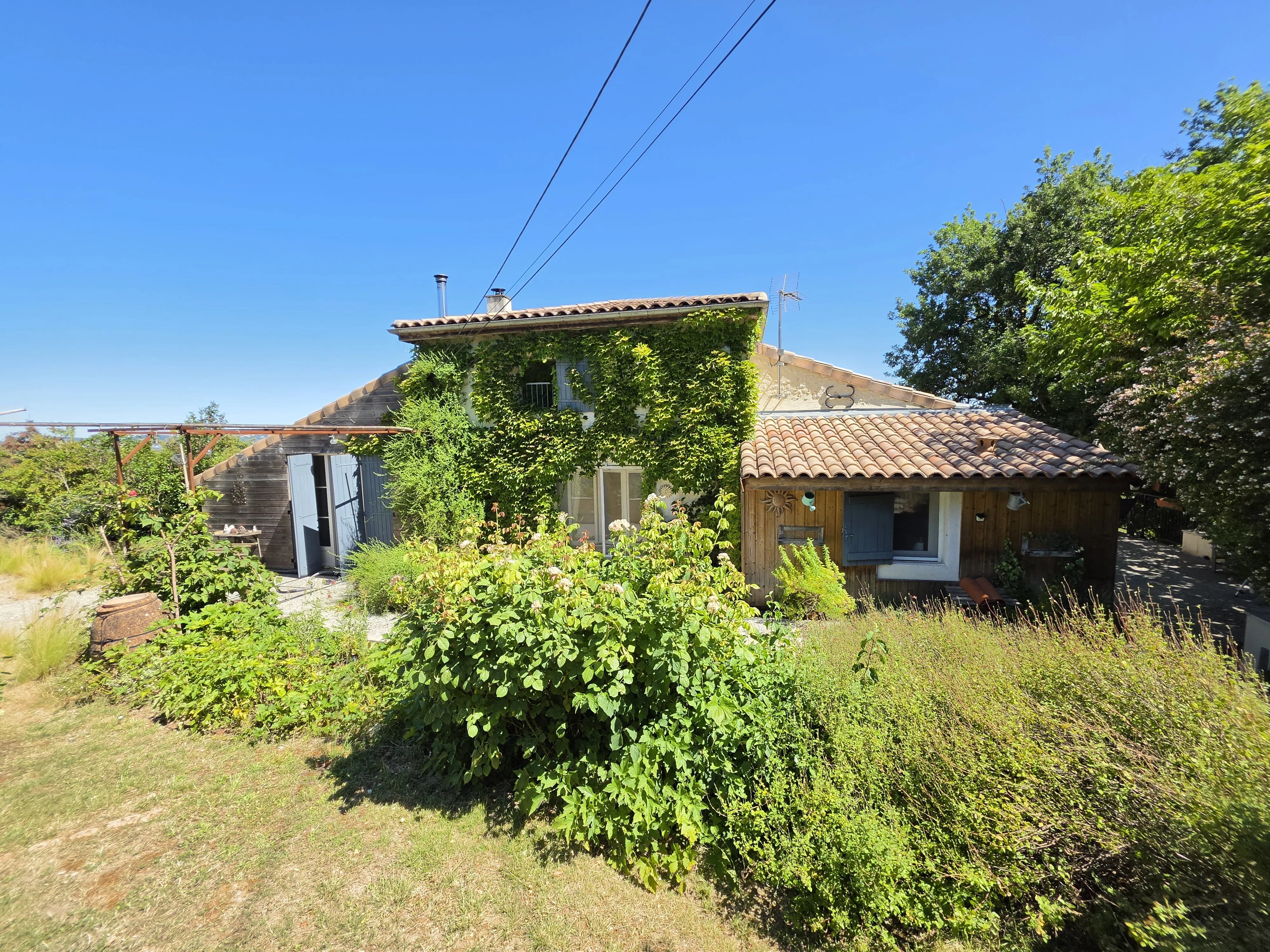 Character Stone Property with Renovated Windmill and 3.1 Hectares for Sale near Prayssas, Lot-et-Garonne