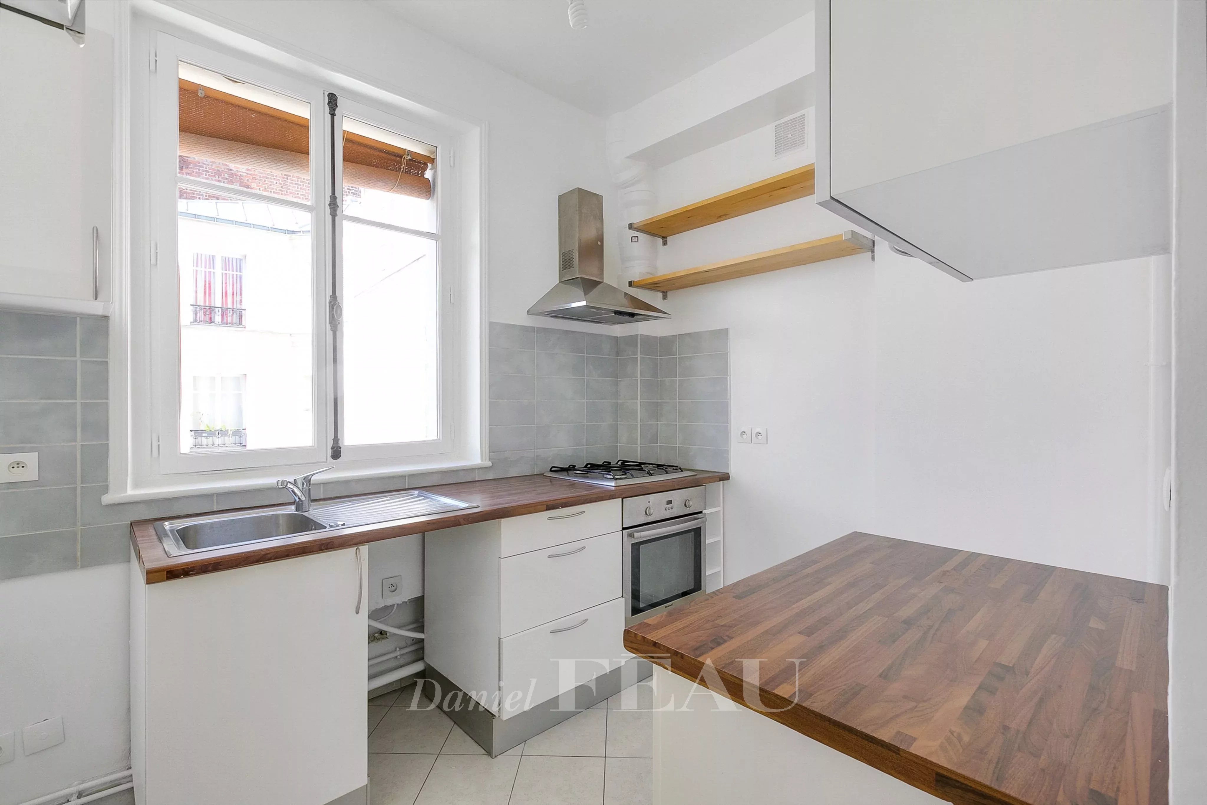 Kitchen Natural light Wooden floor Tile