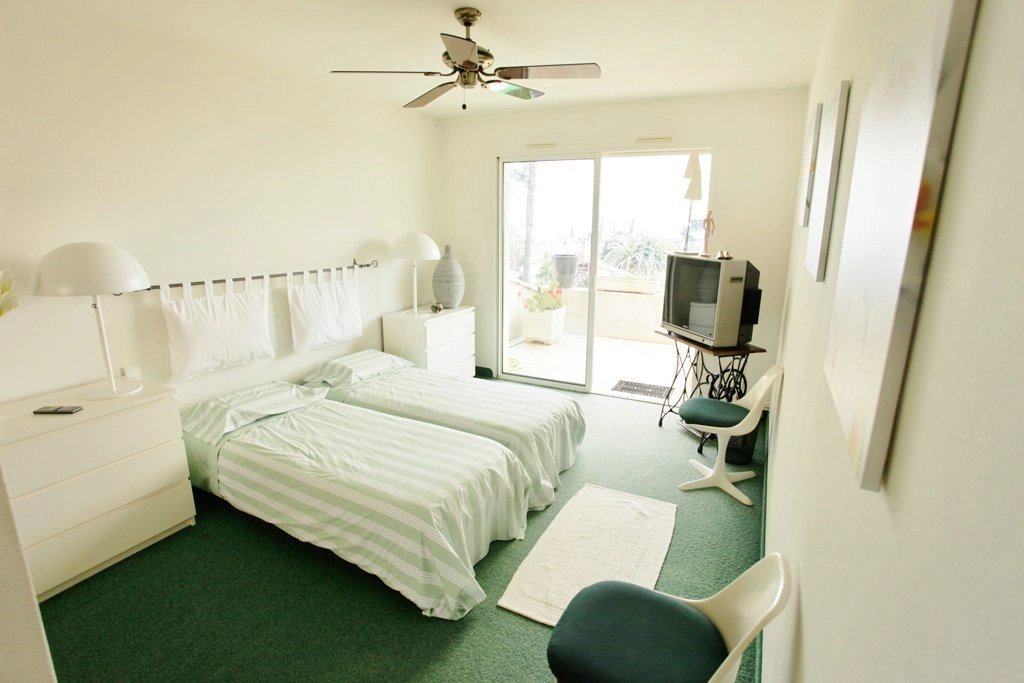Bedroom 1ceiling fan, natural light, carpet