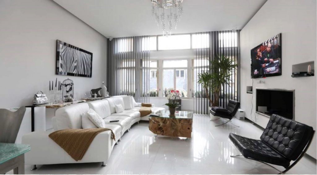 Living-room, chandelier, natural light, high ceiling, fireplace
