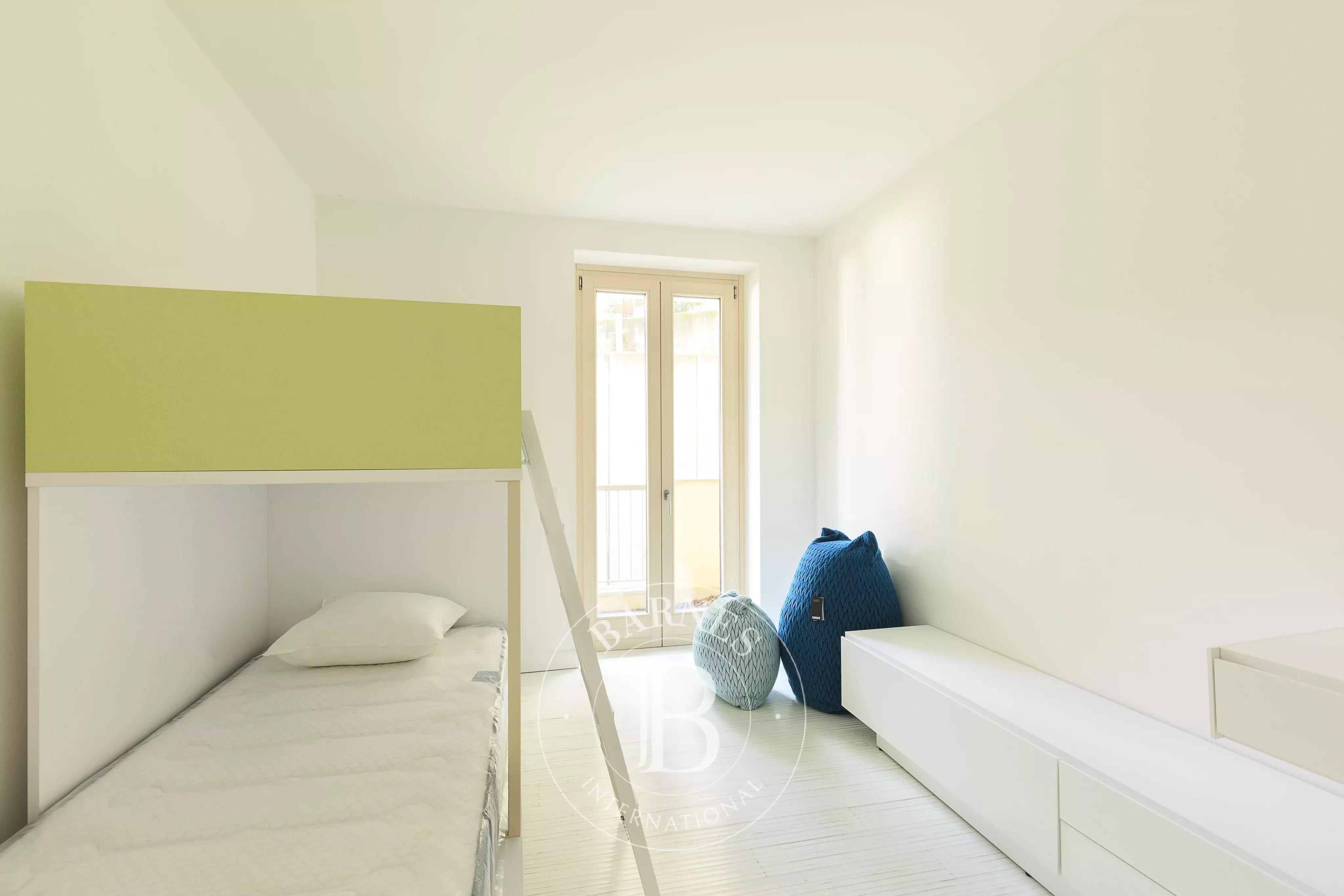 Duplex multi-room apartment in Campione D'Italia - picture 19 title=