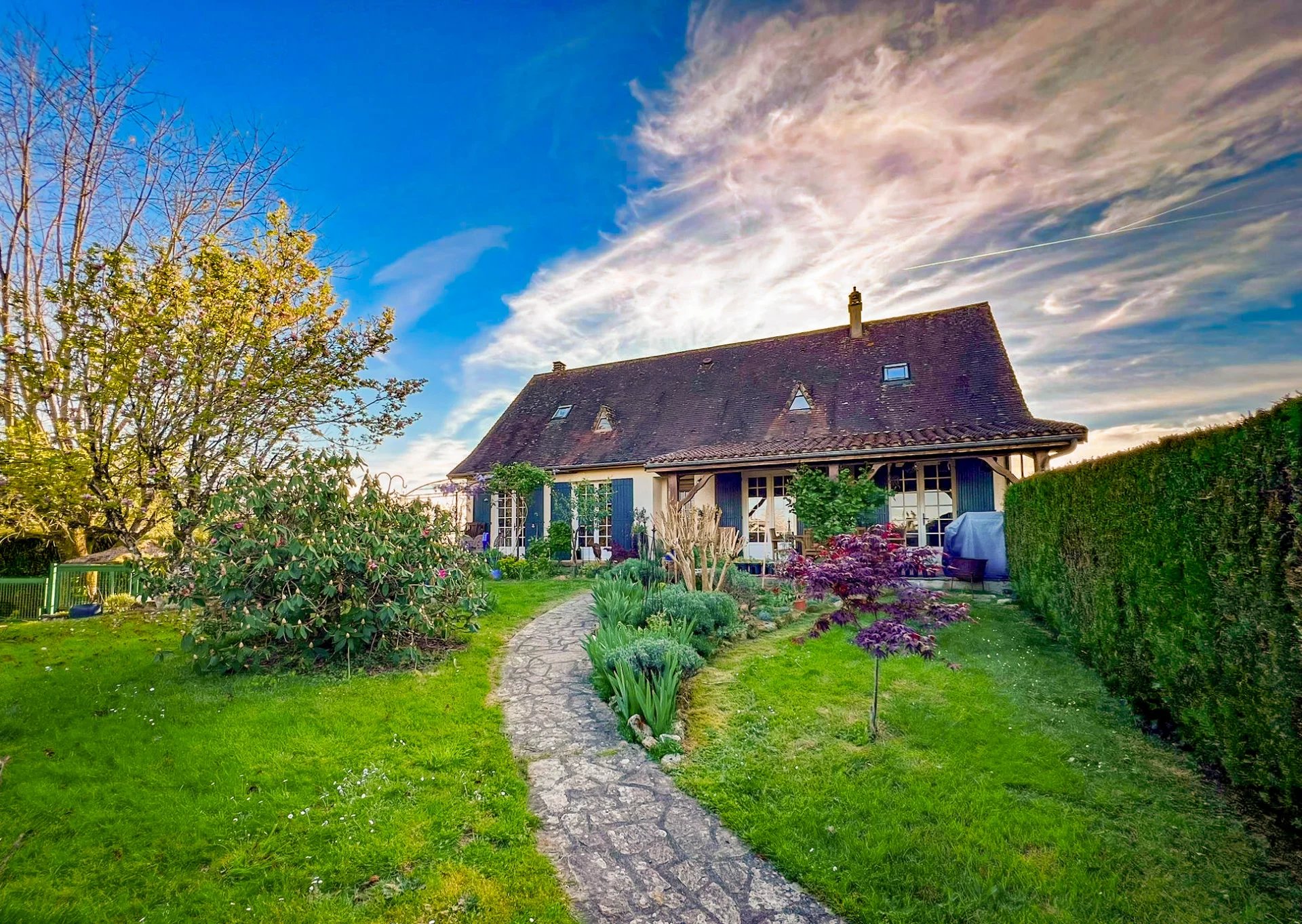 Pretty detached house - walking distance to vibrant village, with independent guest annexe.