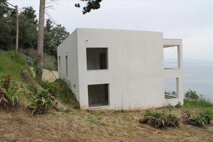 For sale 2-storey villa of 200 sq.meters on the island of Corfu. The ground floor consists of 2 bedrooms, living room with kitchen, one bathroom, one WC. The first floor consists of 2 bedrooms, livin