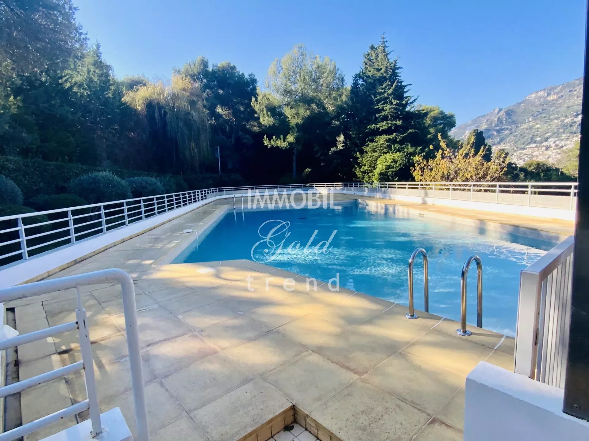 Real estate Roquebrune Cap Martin - For sale, two bedroom apartment with garden, parking and cellar, in a co-ownership with swimming pool
