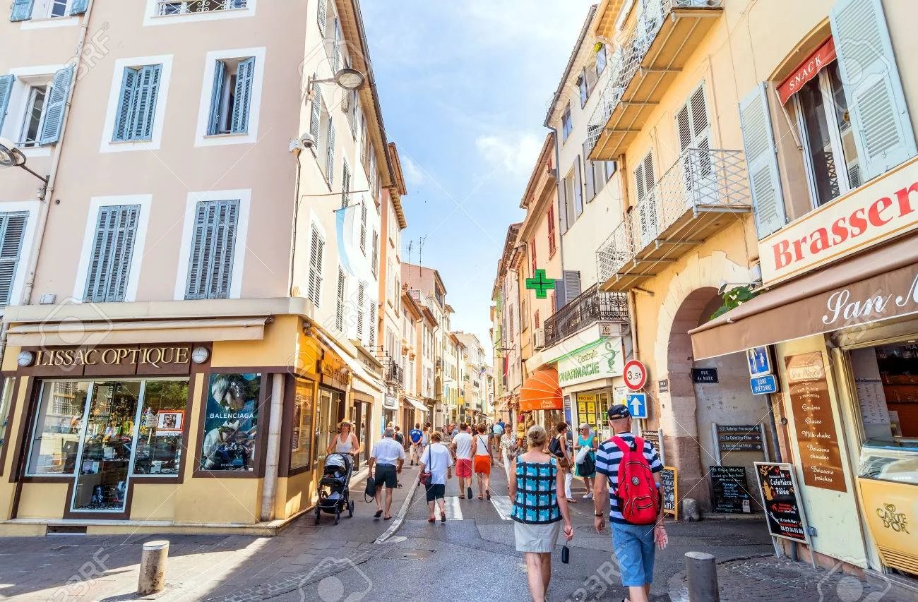 Antibes, France - June 27, 2016: day view of main street Rue de la Republique with tourists in Antibes, France. Antibes is a popular seaside town in the heart of the Cote d'Azur. Alpes Maritimes, Anti