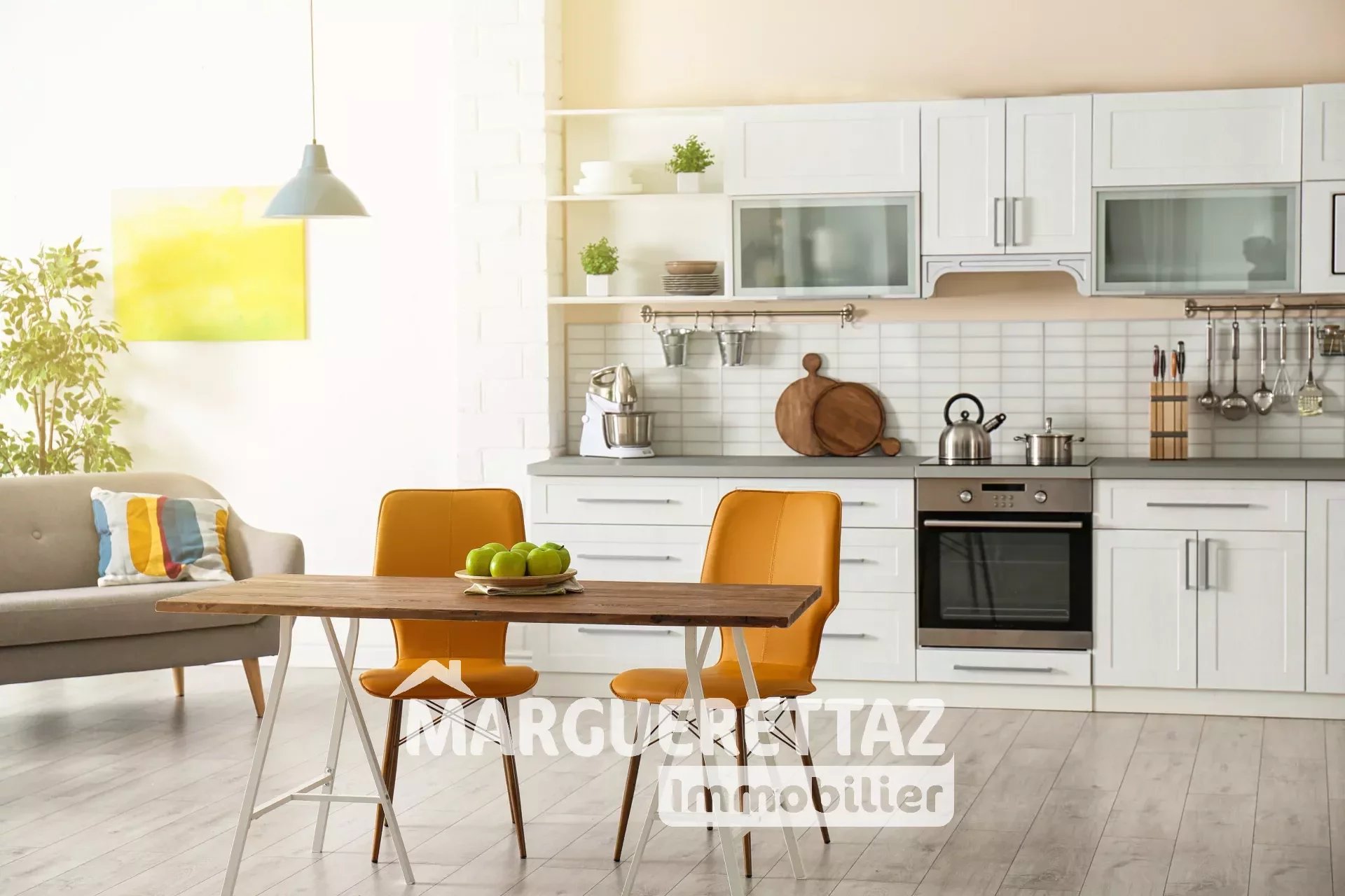 Stylish apartment interior with kitchen furniture and sofa
