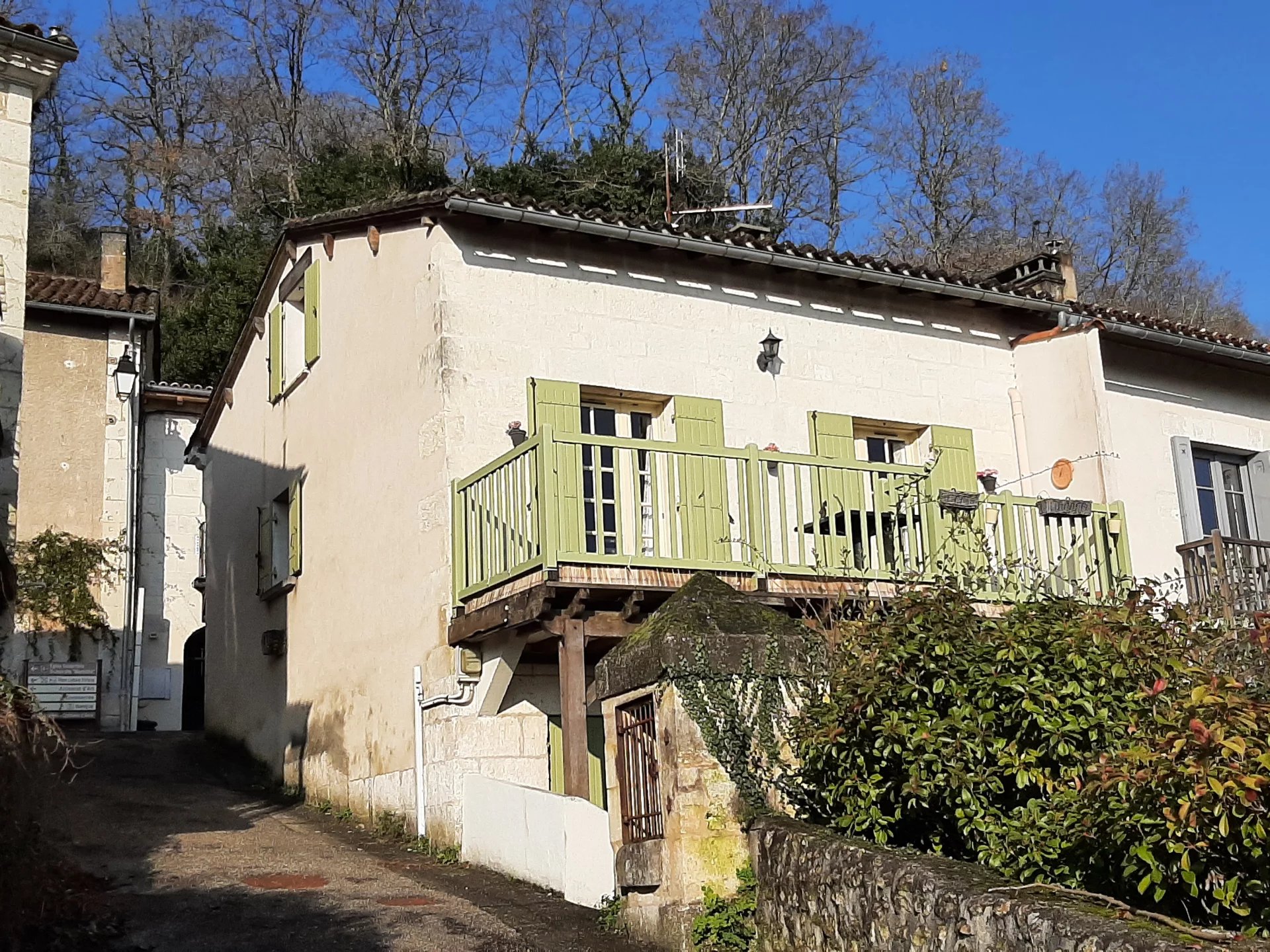 Well appointed village house with sunny balcony overlooking the river