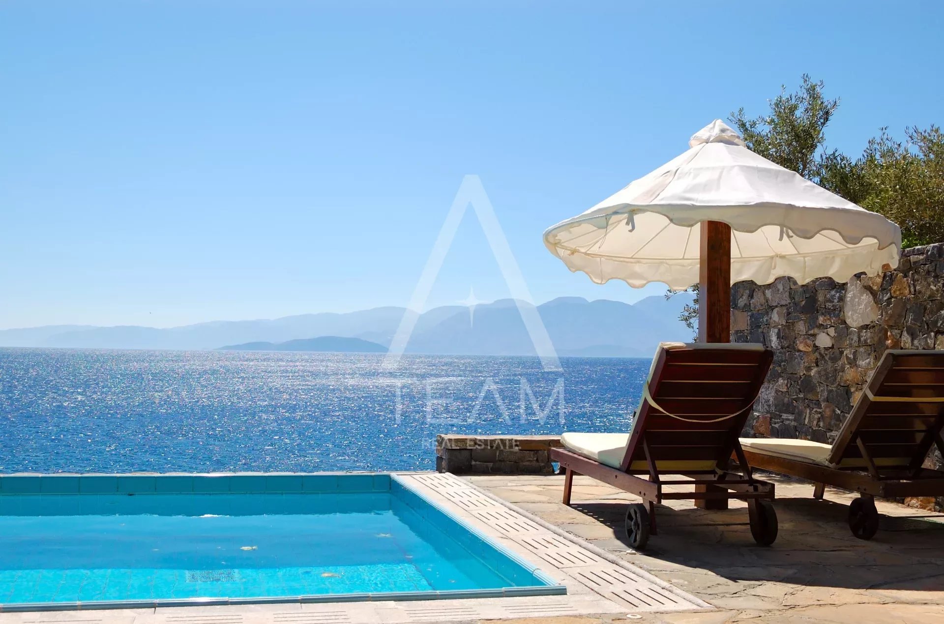 tourism,turquoise,holiday,sea,summer,beautiful,swimming,mountain,view,greece,sunbed,design,vacation,resort,decoration,sky,luxurious,nature,umbrella,island,recreation,relaxation,pool,deckchair,aegean,w