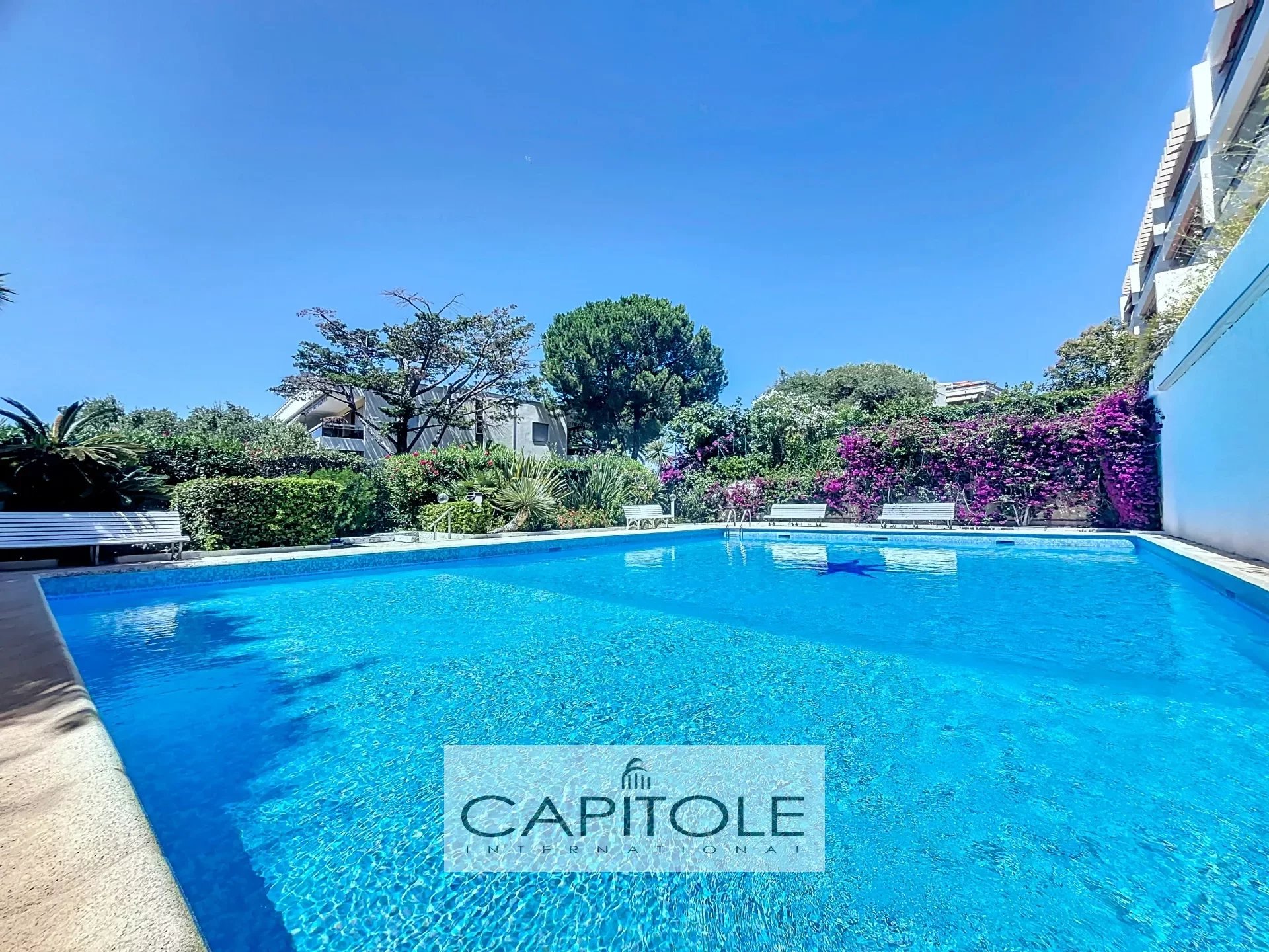 FOR SALE: Rostagne, 2-bedrooms garden-level apartment with pool, double garage, cellar, and concierge.